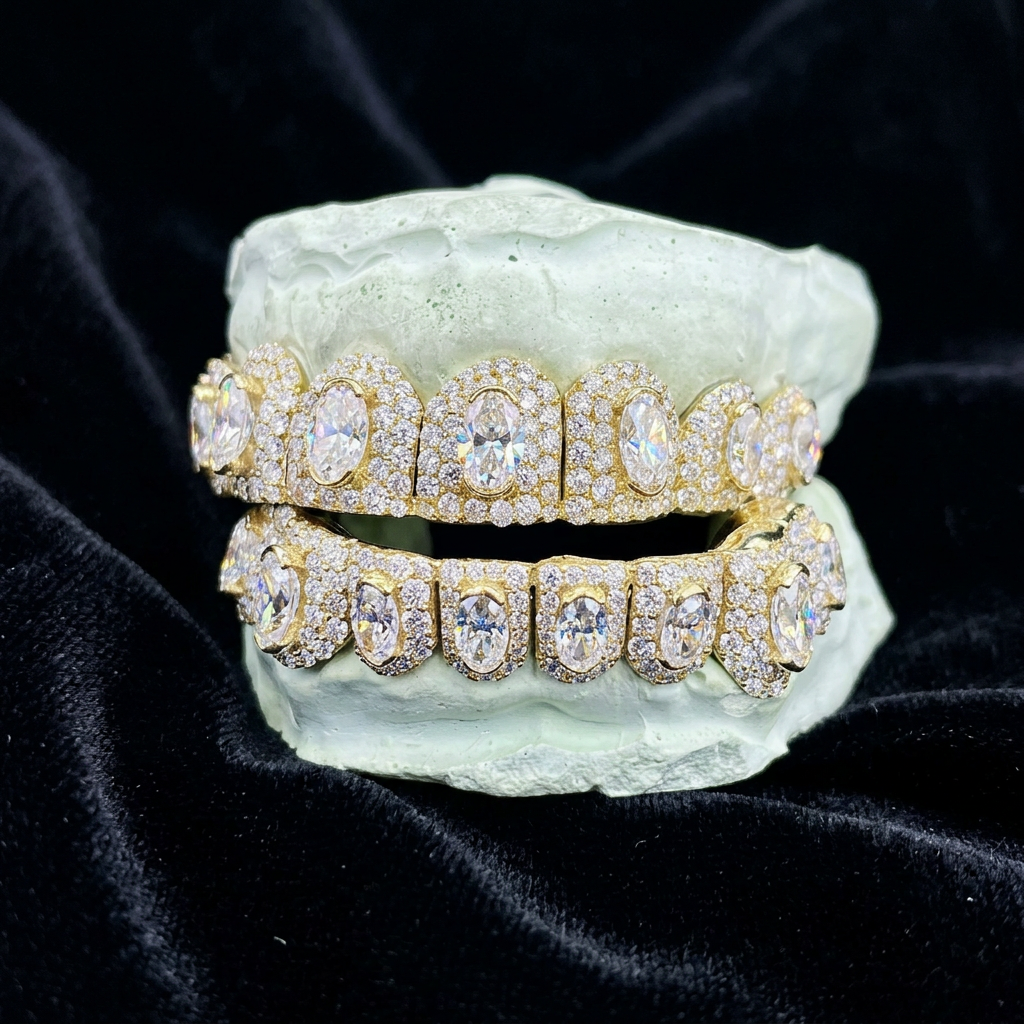 Gold oval diamond halo grillz set on black velvet
